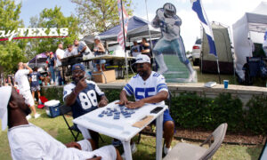 Dallas Cowboys fans tailgate before home game.