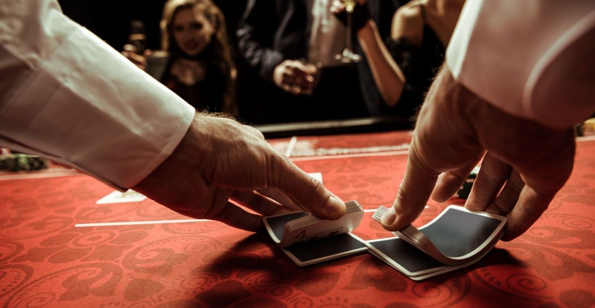 Dealer shuffling cards, signifying shady dealings at Houston card rroms