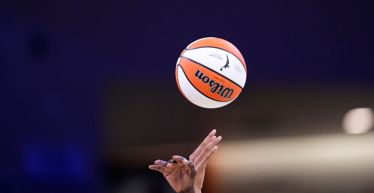 WNBA logo on a Dallas Wings basketball signifies DraftKings partnership with the WNBA
