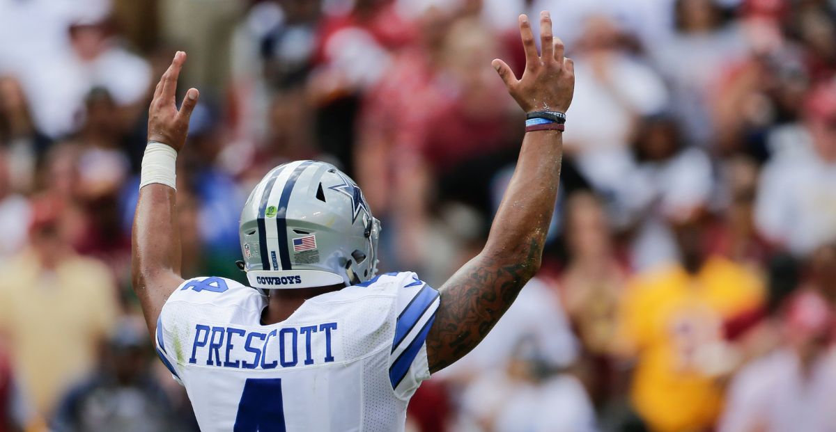 Dak Prescott with raised hands signifies Fliff promo offers ahead of NFL week 1
