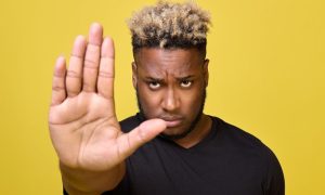 Person holding up a hand indicating stop spreading nonsense. Despite talk from lobbyists that Texas could legalize casinos and sports betting as soon as 2025, political headwinds remain strong.