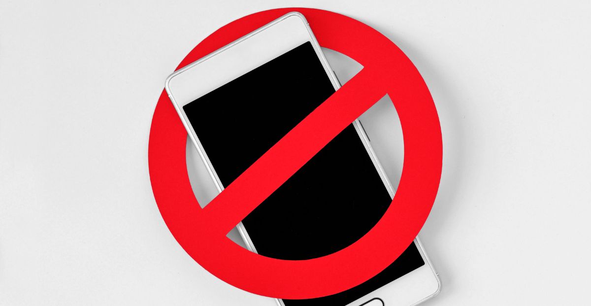 a banned symbol over a cell phone