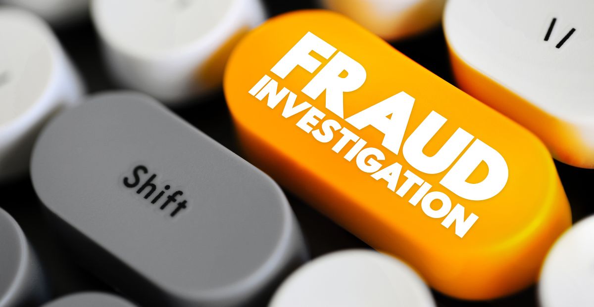 a keyboard that features a fraud investigation button over the shift key