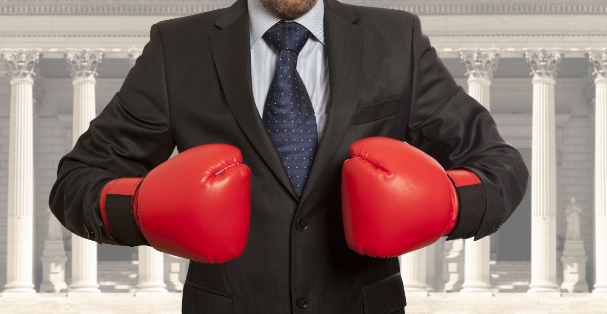 a lawyer wearing boxing gloves